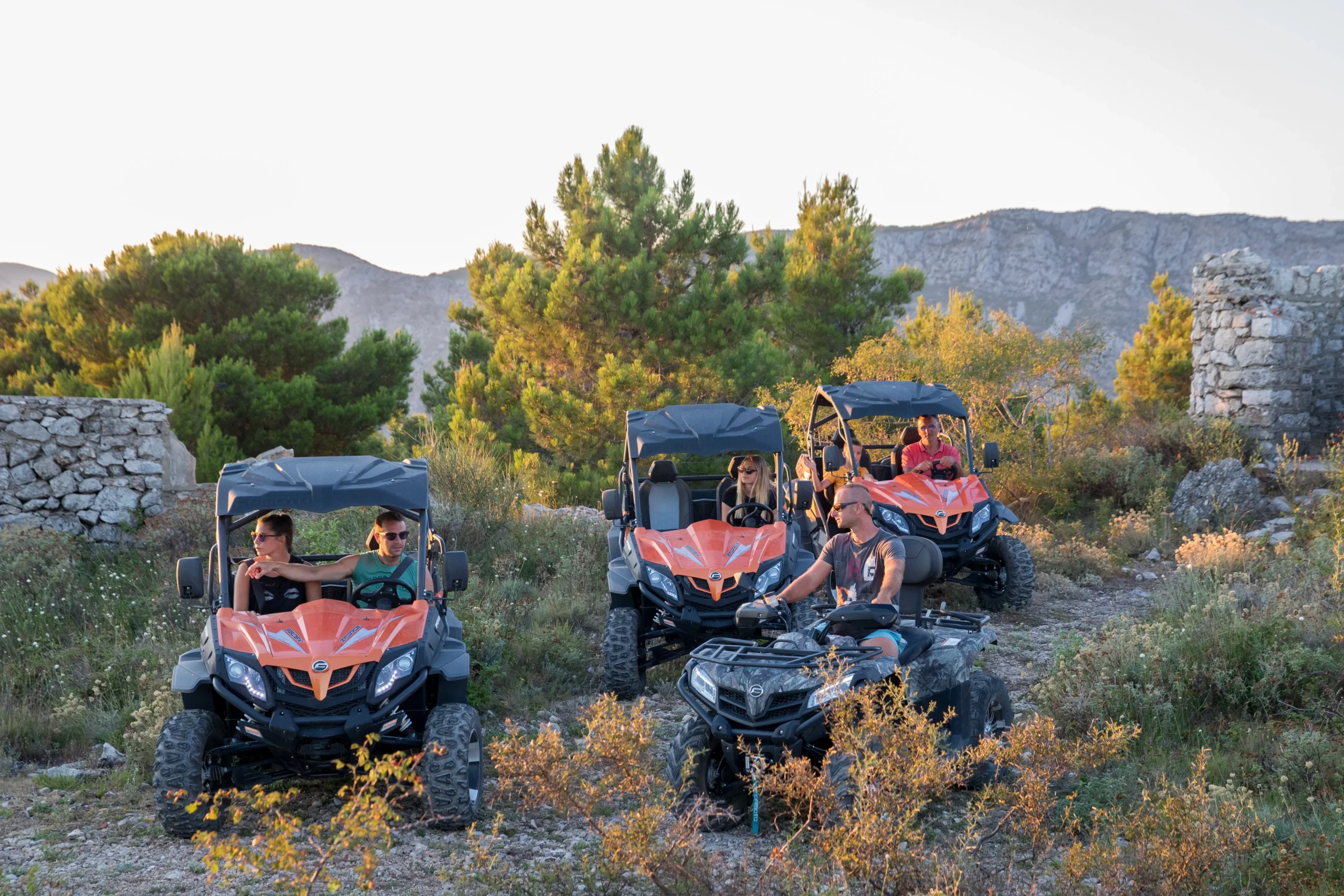 A professional guide leading a group of buggies on an off-road adventure.